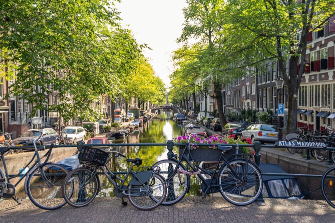 Amsterdam Walking Tour and Cruise with Drinks and Cheese Tasting - Nieuwmarkt and Jodenbuurt: Market Gates and the Jewish Neighborhood Story