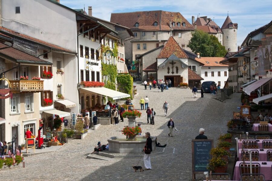 From Geneva: Gruyères Cheese & Chocolate Full-Day Trip - Entering Gruyères medieval village and Castle Gruyères
