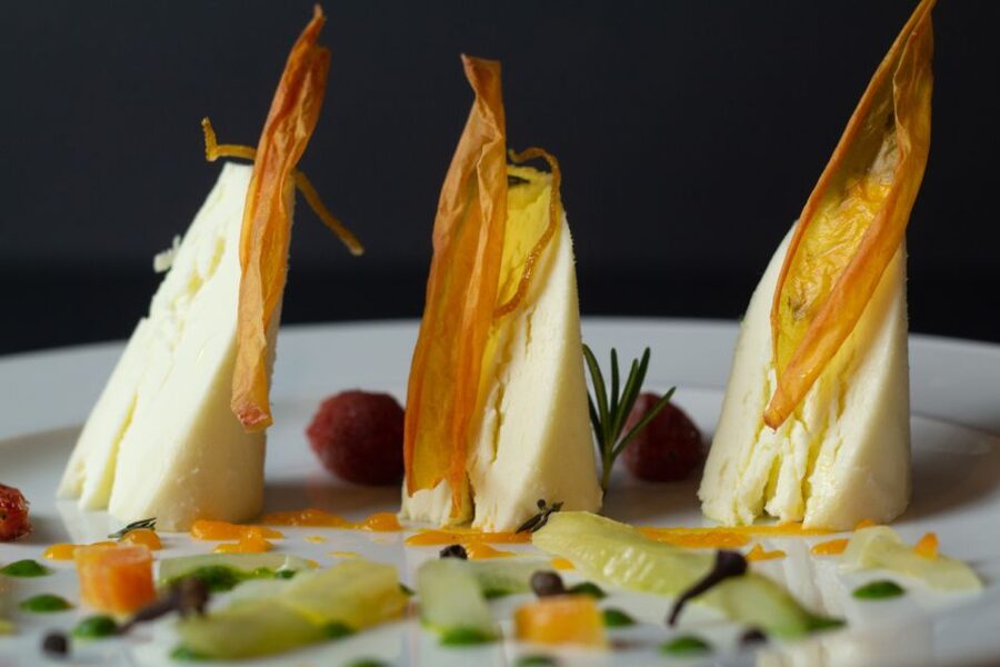Lake Como: Cheese Factory Tour and Tasting in Valsassina - The tasting spread: 8 cheeses with compotes, honey, wine, water, and coffee