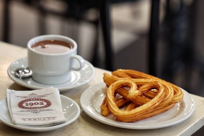 Madrid Bike Tour with Churros and Wine, Ham, and Cheese Upgrade - A Chance to See Mercado de San Miguel If Time Allows