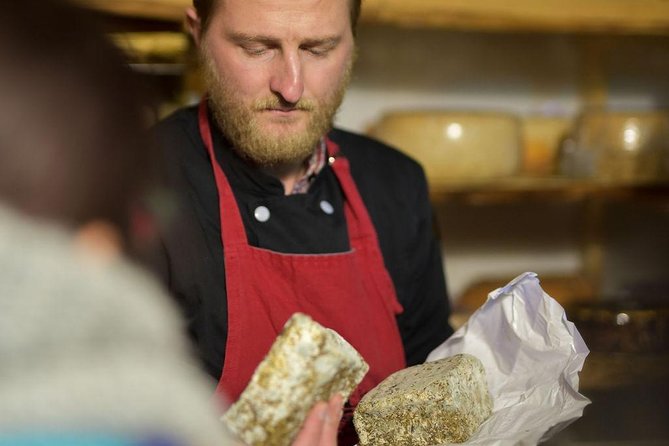 Paris Art of Pairing Cheese and Wine Tasting in a Cheese Cellar - The protective suit and why you’re suited up