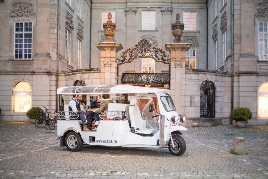 Zurich: Swiss Cheese Fondue and Wine e-Tuk-Tuk Tour - Meeting at the Weekday store by Zurich main station